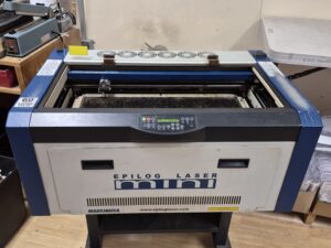 2012 Epilog Mini laser engraver front view with the lid open