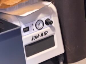 JUN-AIR enclosed air compressor with front pressure gauge and regulator in Los Gatos