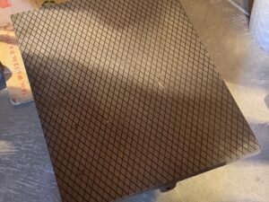 Angled view of the lapping plate crosshatched grooves