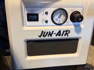 Front view of the JUN-AIR compressor showing the pressure gauge and regulator