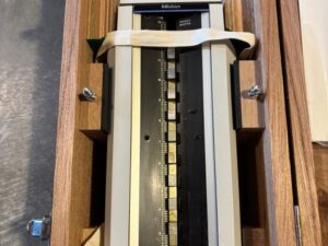 Mitutoyo Height Master secured in its fitted wooden storage case