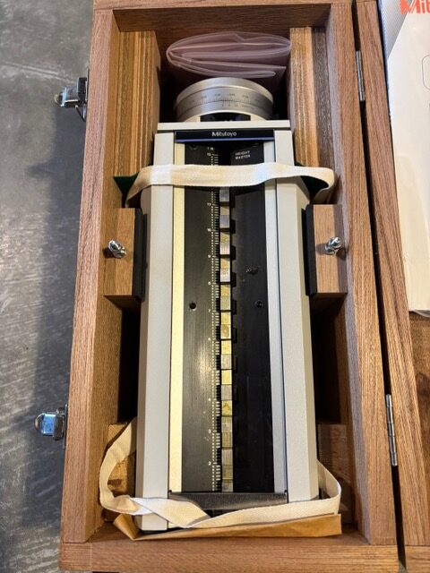 Mitutoyo Height Master secured in its fitted wooden storage case