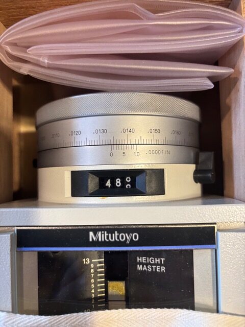 Close-up of the Mitutoyo Height Master measuring head and scale